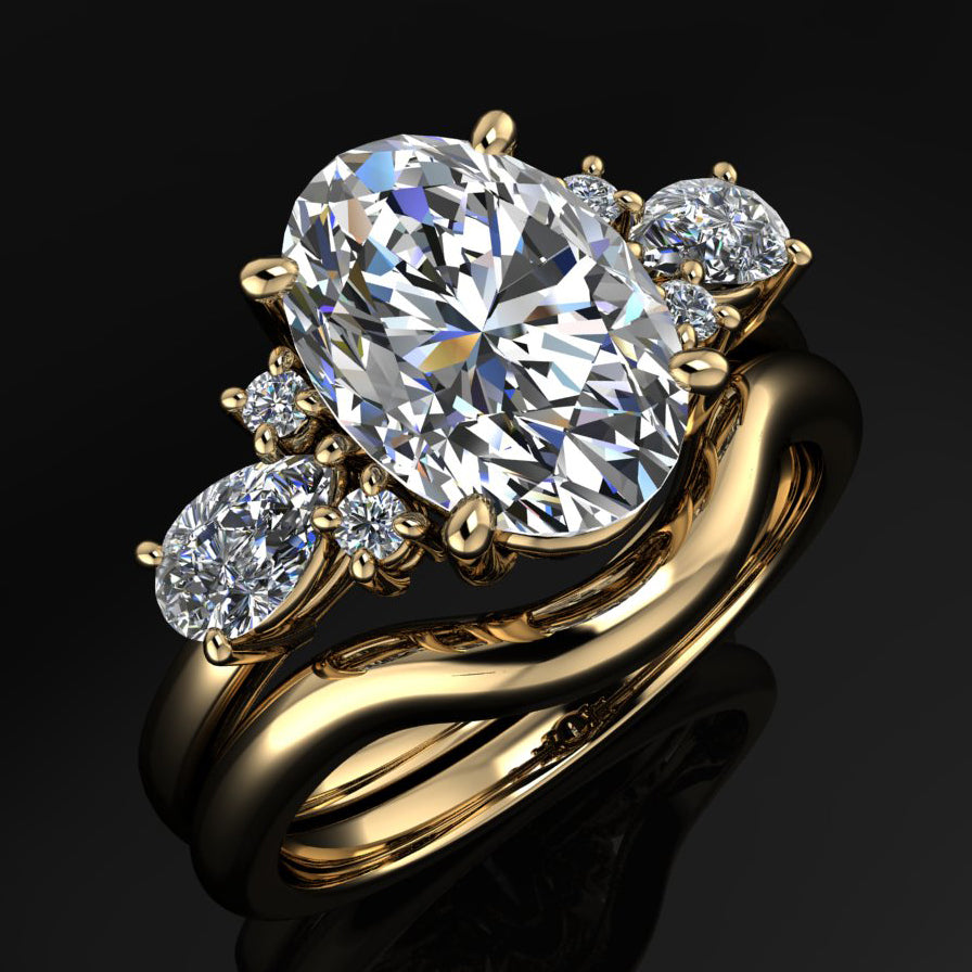 solid gold contoured wedding band next to the matching oval engagement ring - scarlett wedding band