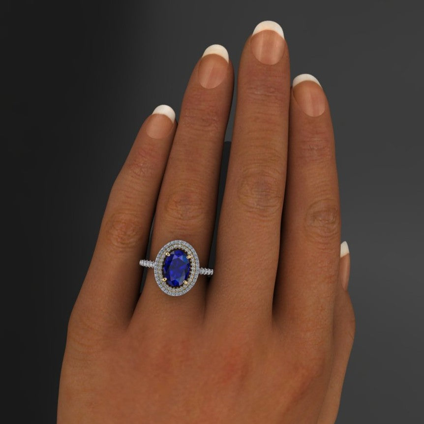 2.5 carat oval blue moissanite ring with a double halo with diamonds - hand model