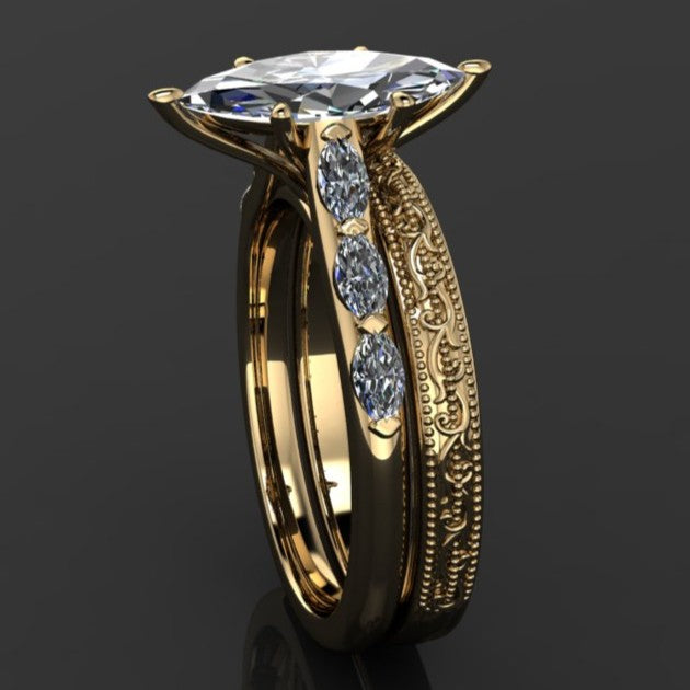 2 carat marquise engagement ring with marquise side stones and a vintage inspired wedding band - profile view