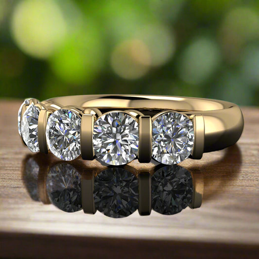 olivia ring - 2.5 carat round diamond ring, lab grown diamonds, solid gold ring - laying flat on a wood table with leaves in the background