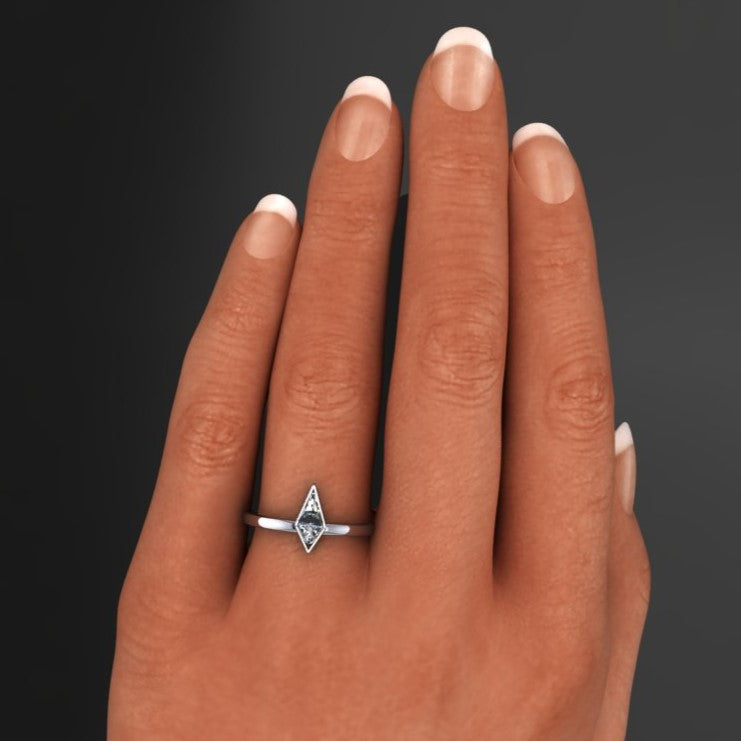 .30 carat moissanite kite, bezel set ring - view on a hand.