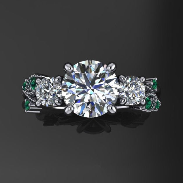 1.5 carat round three stone ring with green moissanite accent stones - top view