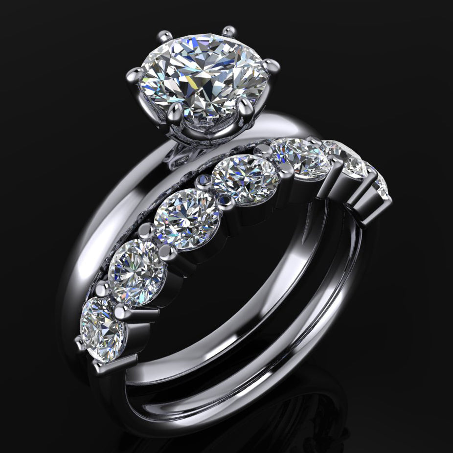 Six prong Phoenix engagement ring set with a round moissanite, paired with a 7 stone Bette anniversary band - angle view