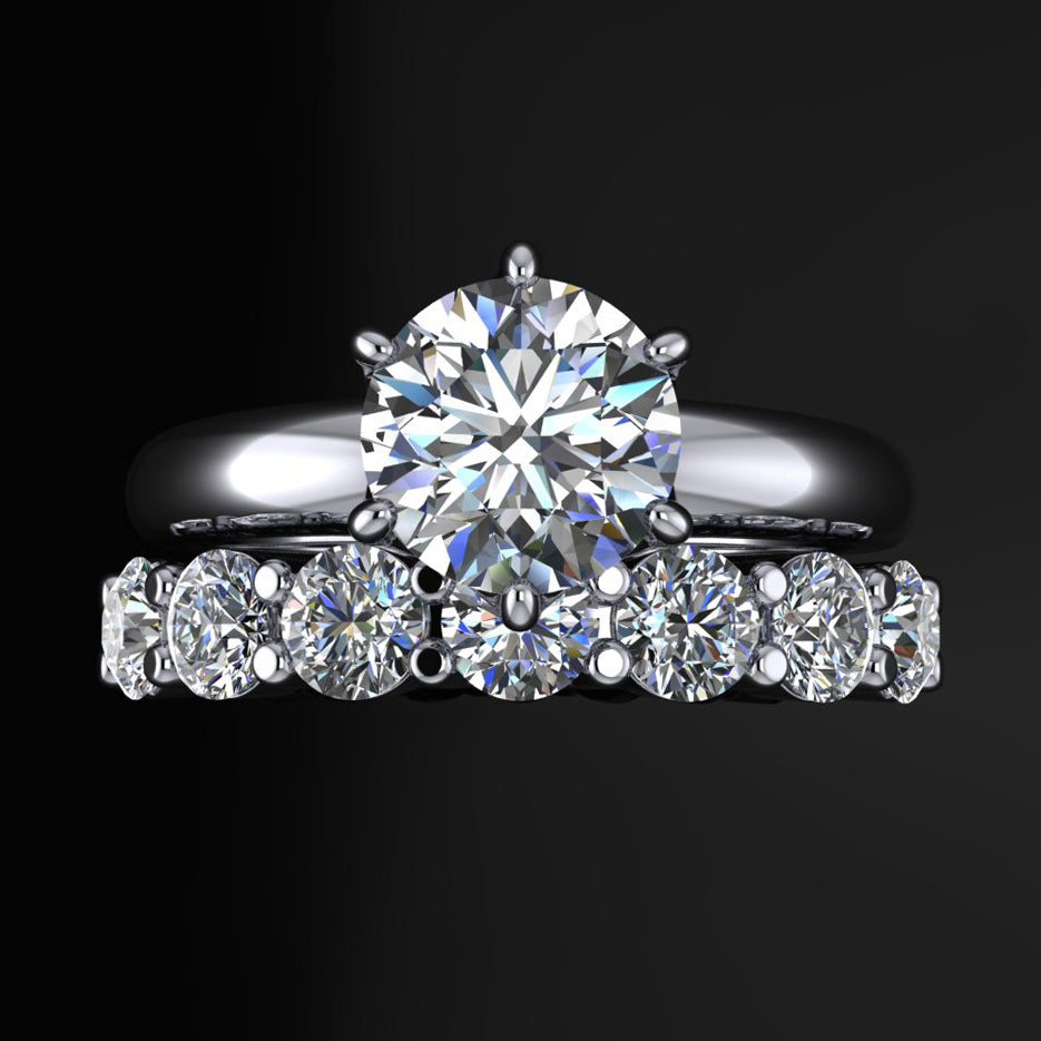 Six prong Phoenix engagement ring set with a round moissanite, paired with a 7 stone Bette anniversary band - top view