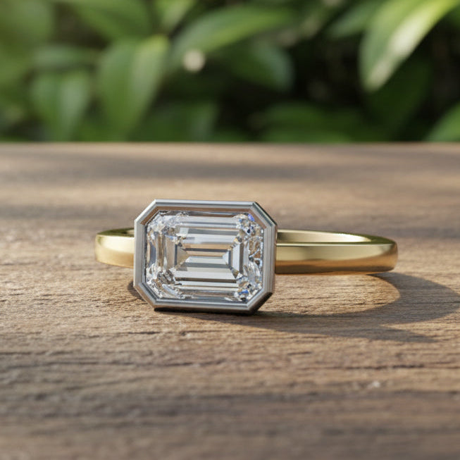 Gold ring with a large diamond on a reflective surface