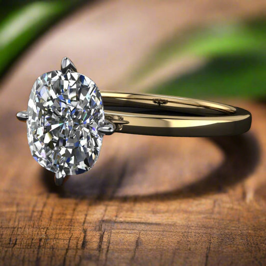2 carat elongated cushion solitaire ring set with north, south, east, west prongs - table view