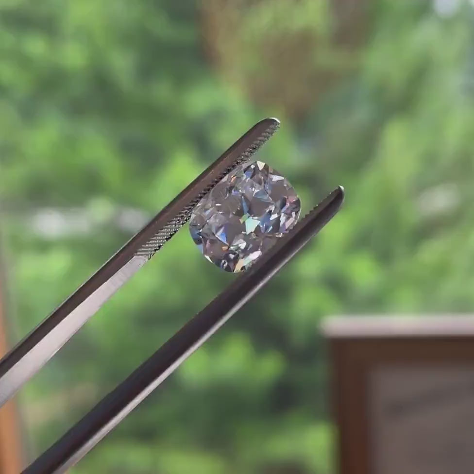 video of an antique cut cushion moissanite