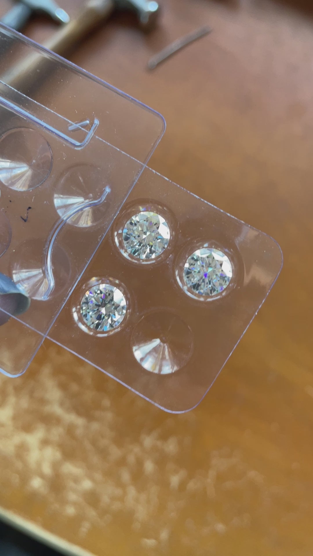 video of loose round moissanite stones