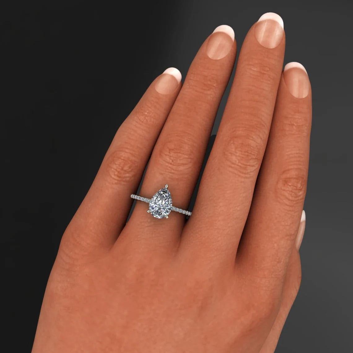 eliza ring - 2 carat pear cut NEO moissanite engagement ring, diamond pave shank on hand model - J Hollywood Designs