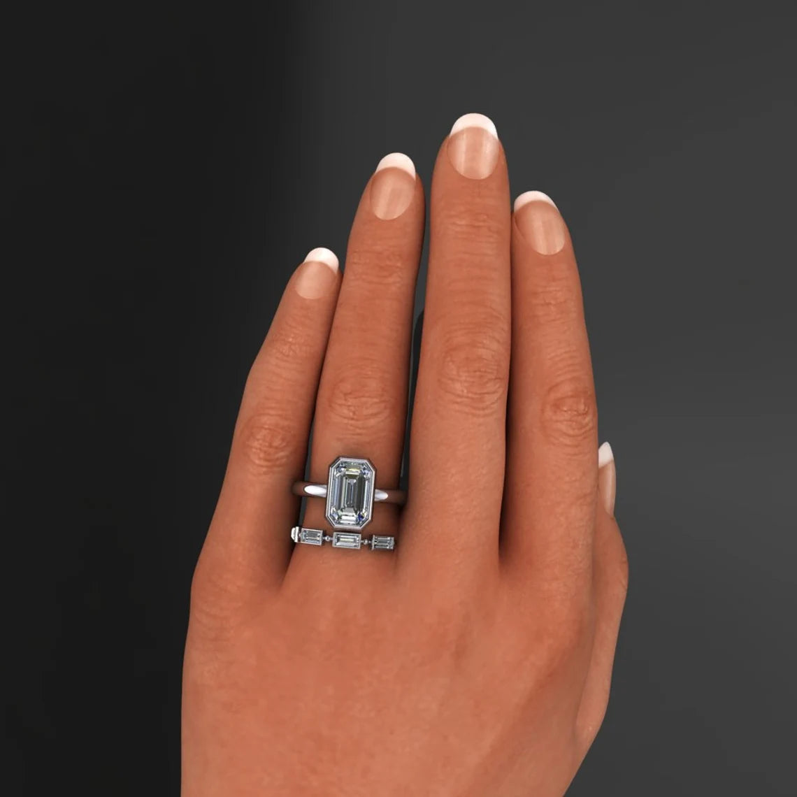 custom maria ring – 2 carat emerald cut ZAYA moissanite ring, bezel wedding set on hand model - J Hollywood Designs