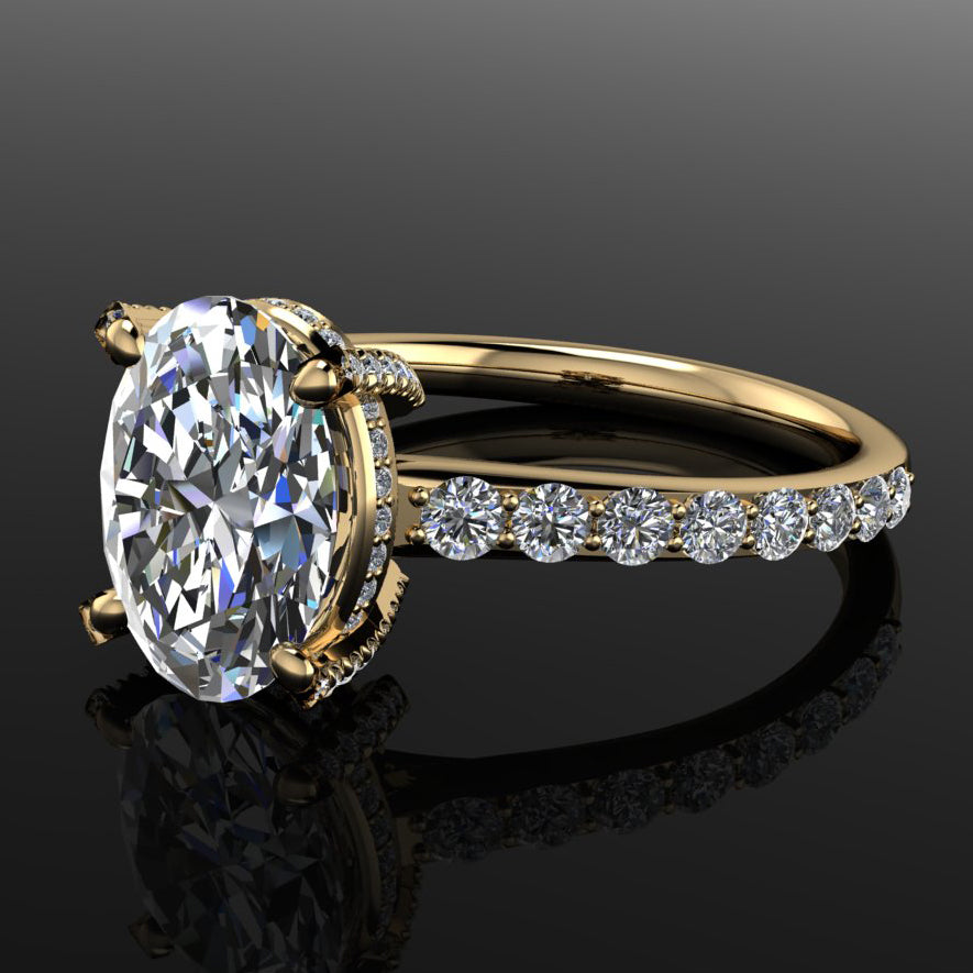 blaire ring - 2.7 carat oval moissanite and diamond ring - laying flat on a table