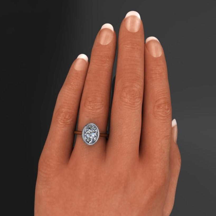 2 carat oval lab grown diamond, bezel set side halo engagement ring, hand model