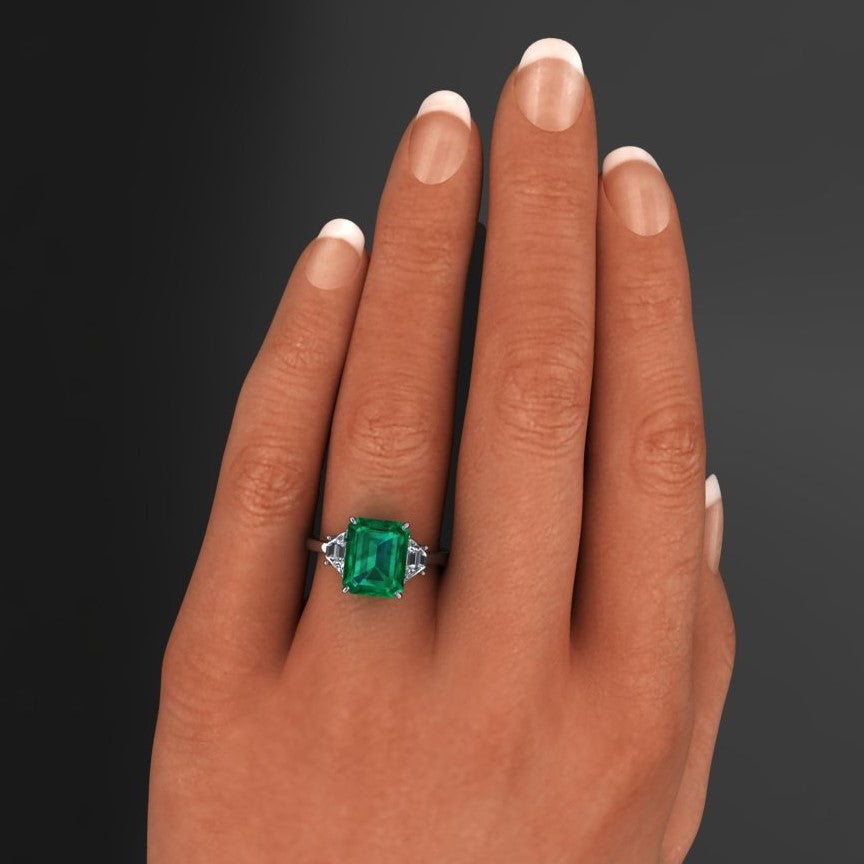 3.5 carat green emerald three stone ring, hand model view
