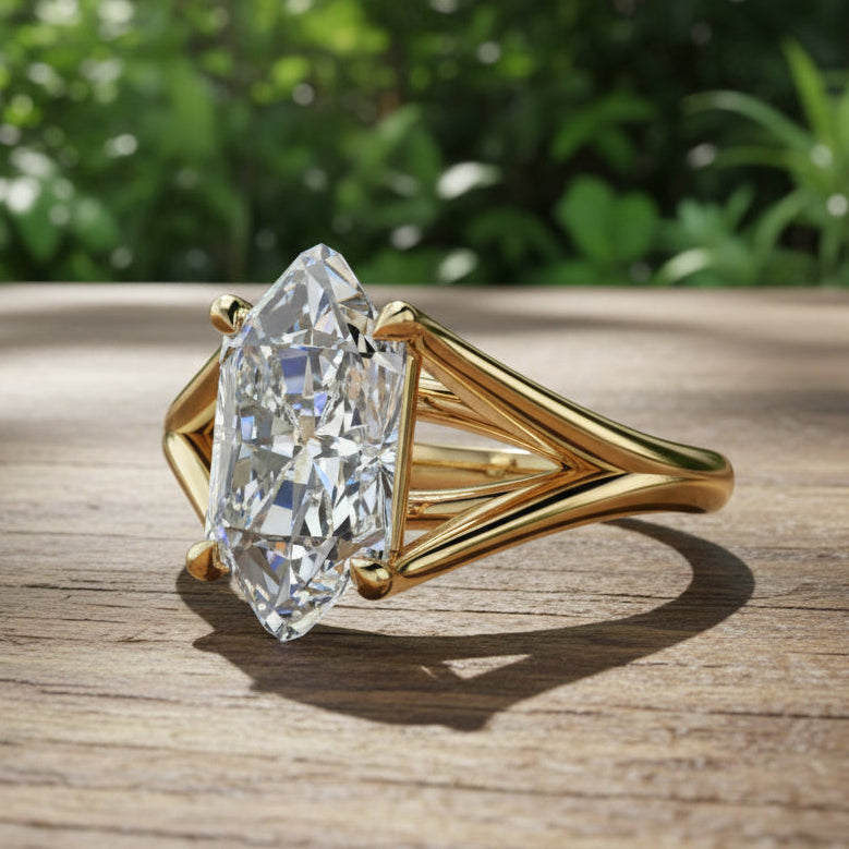 Gold ring with a large diamond on a reflective surface