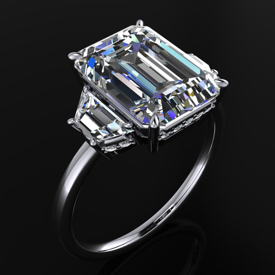 demi ring - 4.3 carat emerald cut and trapezoid engagement ring, side halo - angle view