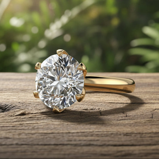 Gold ring with a large diamond on a reflective surface