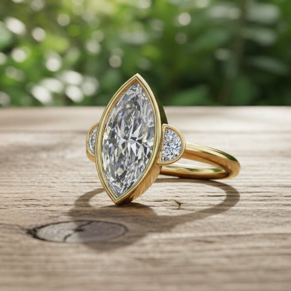 Gold ring with a large diamond and smaller diamonds on a dark background