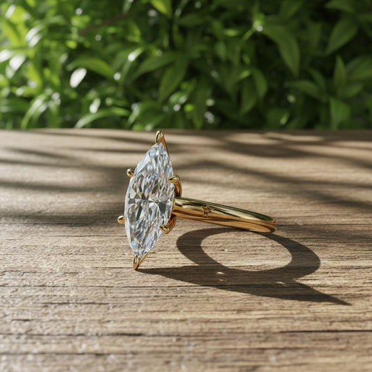 Three carat marquise engagement ring in yellow gold.