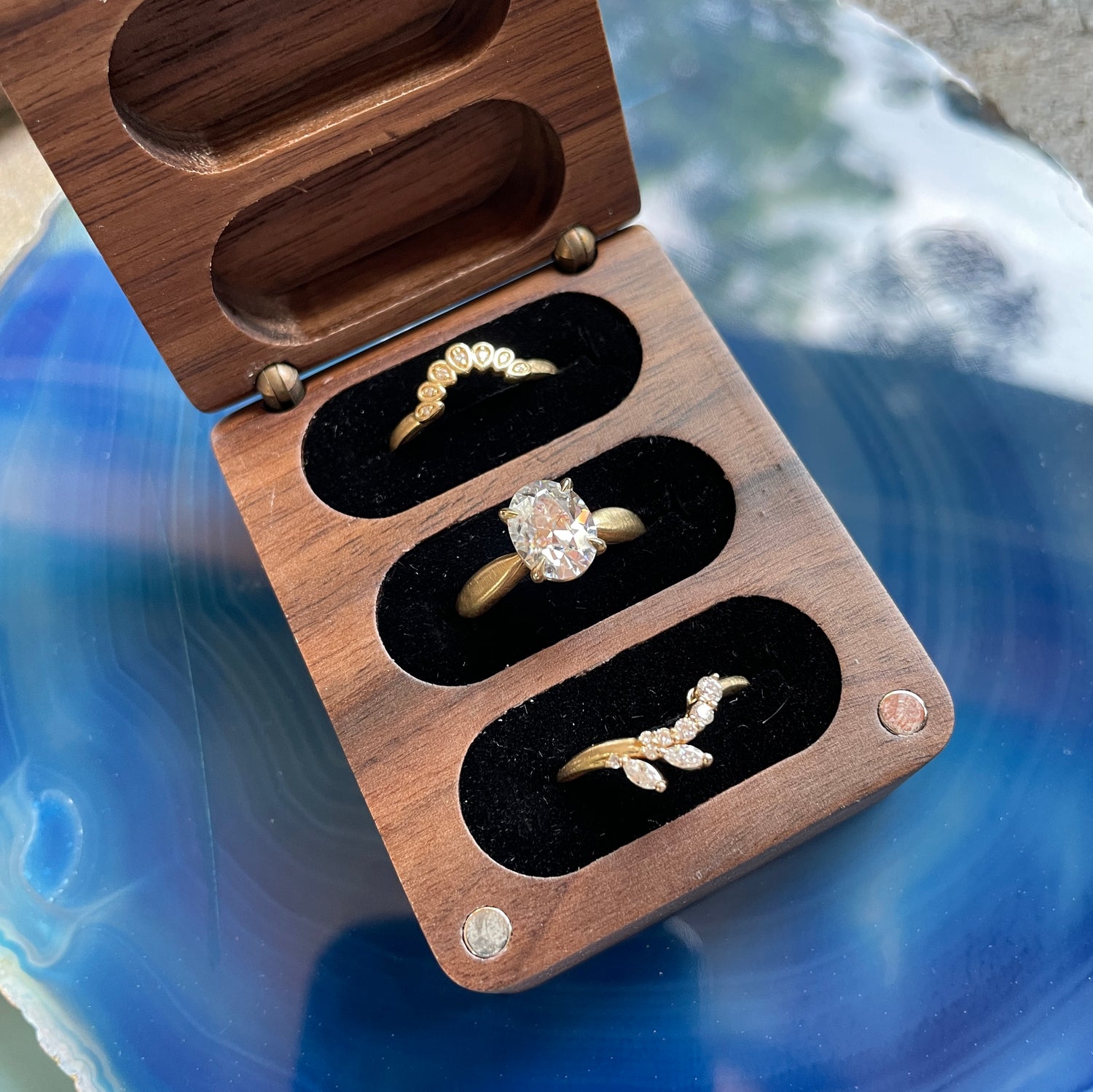 Three ring wedding set in wooden jewelry box