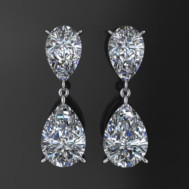 Pair of diamond earrings on a black background