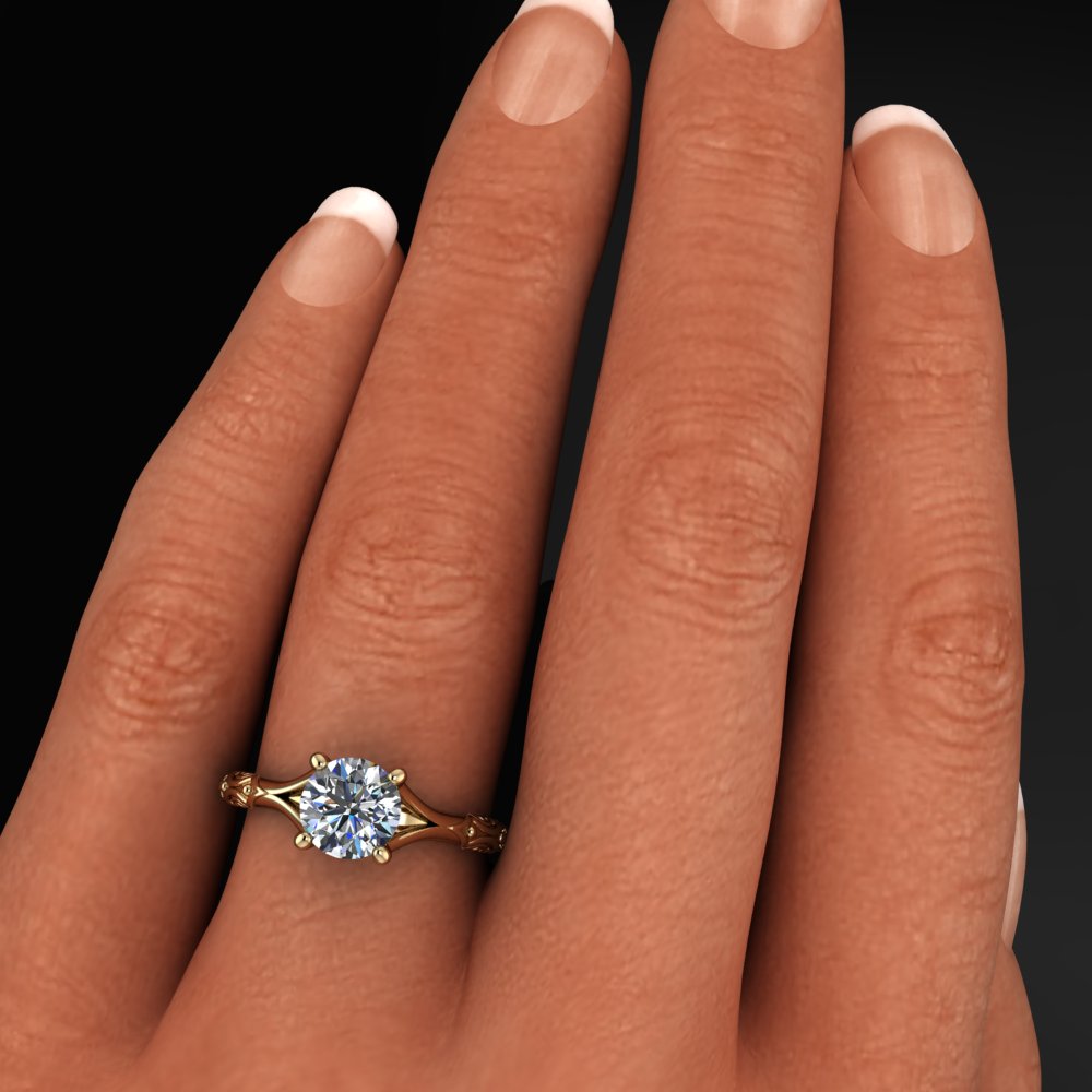 round moissanite engagement ring with pretty detailing on the sides of the band - model shot