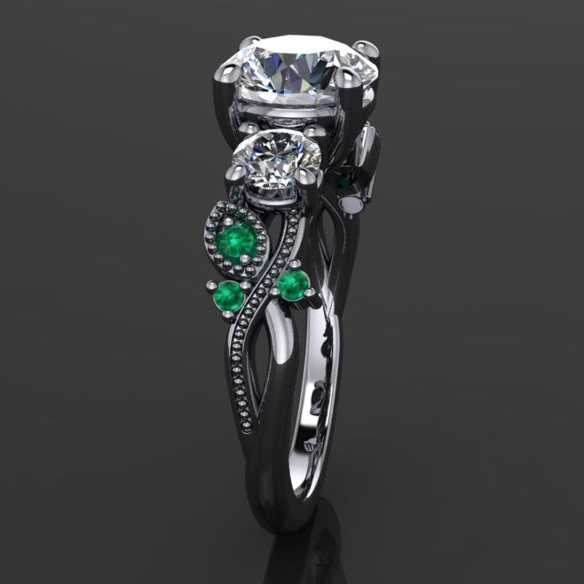 1.5 carat round three stone ring with green moissanite accent stones - side view