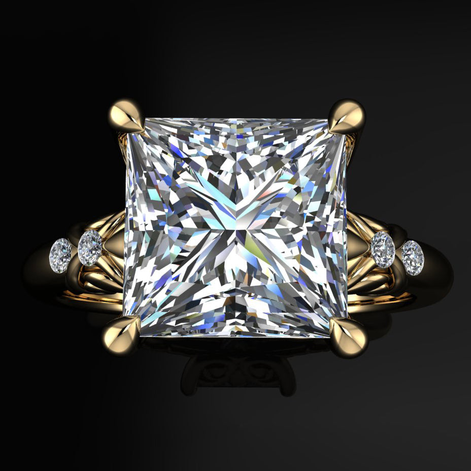 Princess cut gold ring with a large diamond and intricate designs on the band - top view