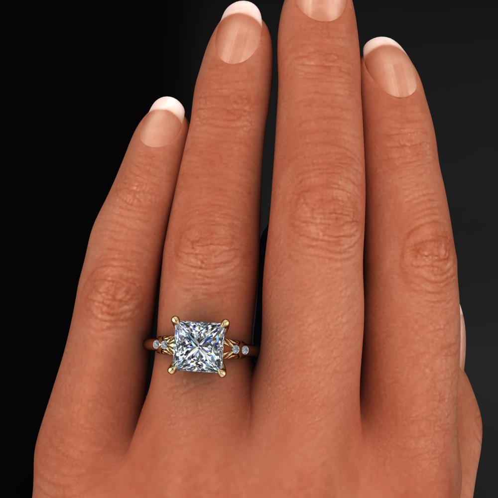 Princess cut gold ring with a large diamond and intricate designs on the band - model shot