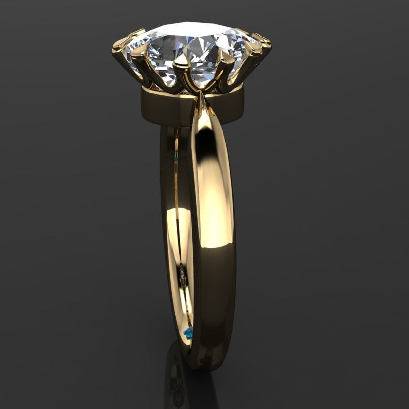 The Lady Danbury ring featuring a 2.5 carat old mine cut cushion moissanite center. A solitaire ring with 10 prongs, side view