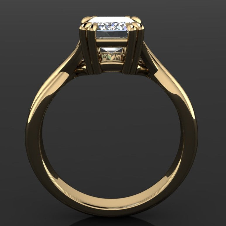 2 carat emerald solitaire ring with a 3.5mm wide band and double claw prongs - profile view