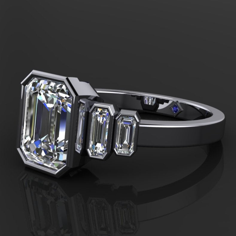 2.5 carat emerald moissanite, 5 stone bezel set ring - sapphire accent view