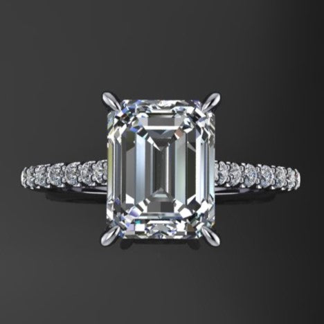 2.5 carat emerald moissanite cathedral engagement ring with a diamond band, top view