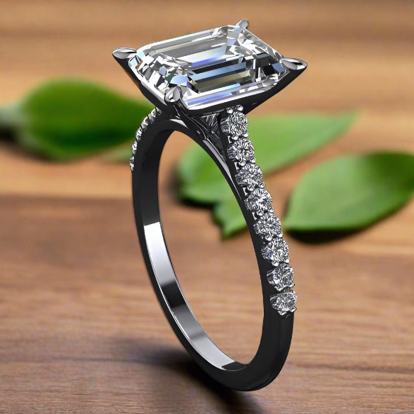 2.5 carat emerald moissanite cathedral engagement ring with a diamond band, second side view
