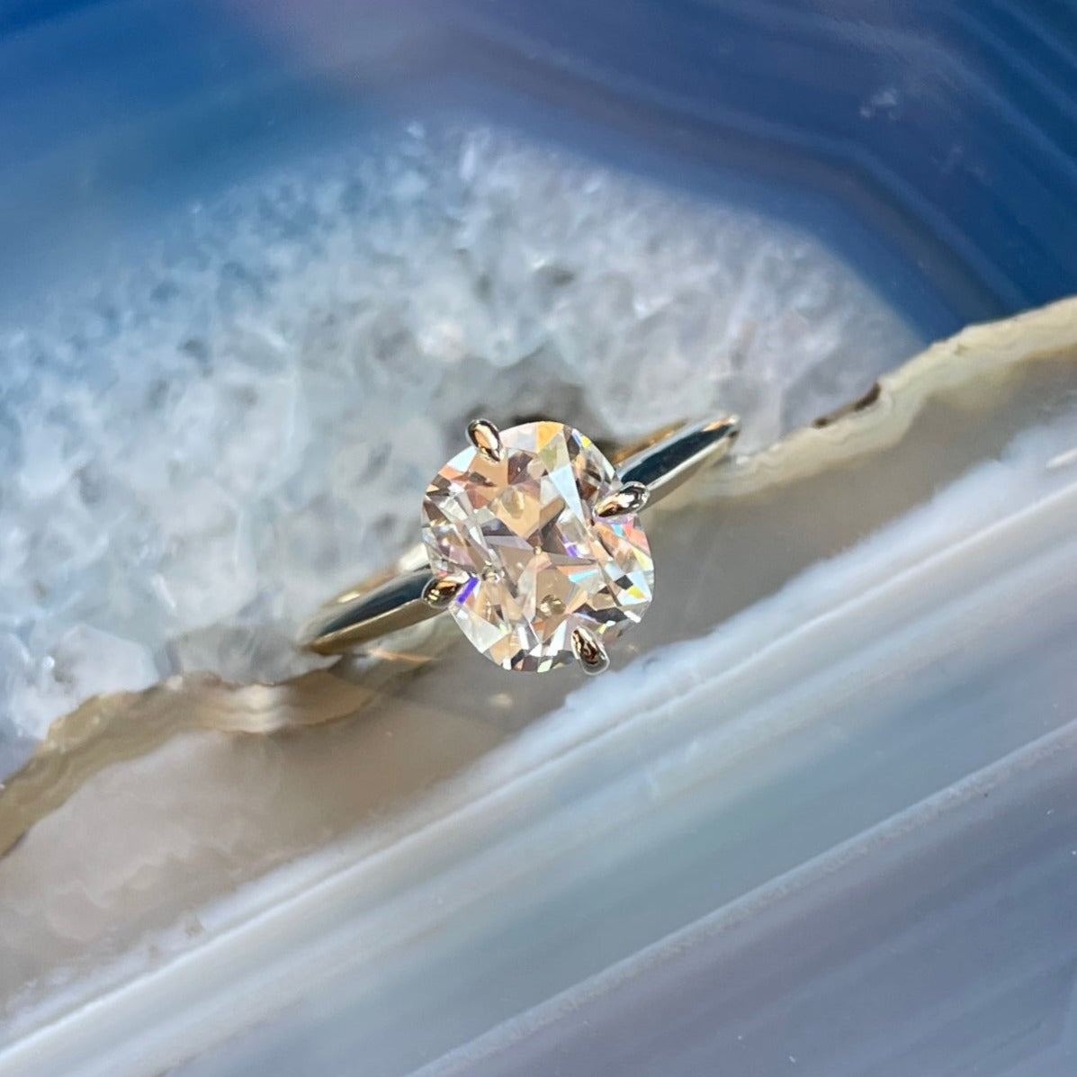 2 carat elongated cushion solitaire ring set with north, south, east, west prongs - top down view 