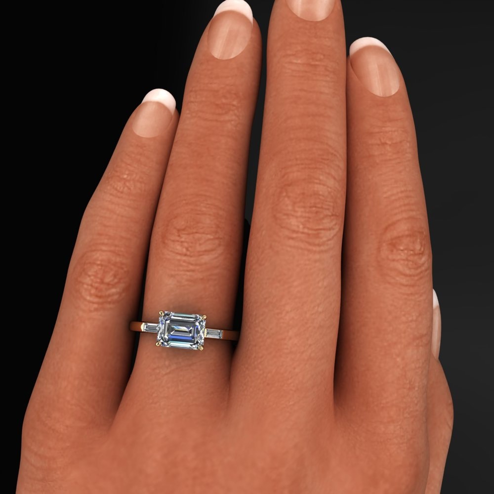 1.5 carat lab grown diamond emerald cut engagement ring, east west engagement ring, three stone ring - hand model