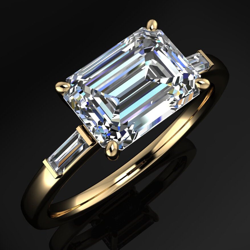 1.5 carat lab grown diamond emerald cut engagement ring, east west engagement ring, three stone ring -angle view