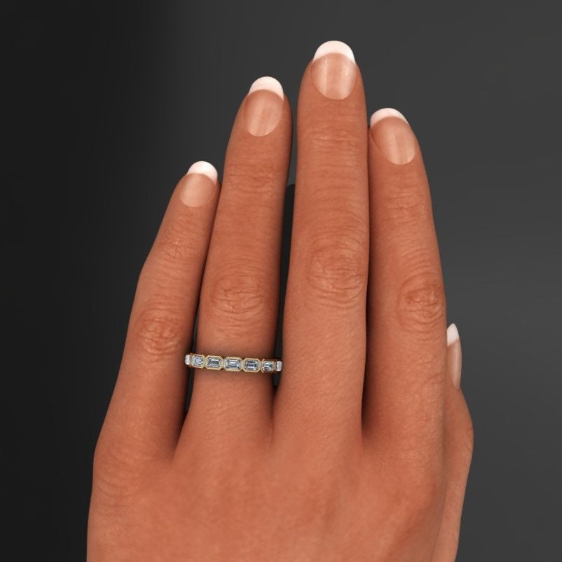 emerald cut lab grown diamond eternity band - bezel set, hand model pic