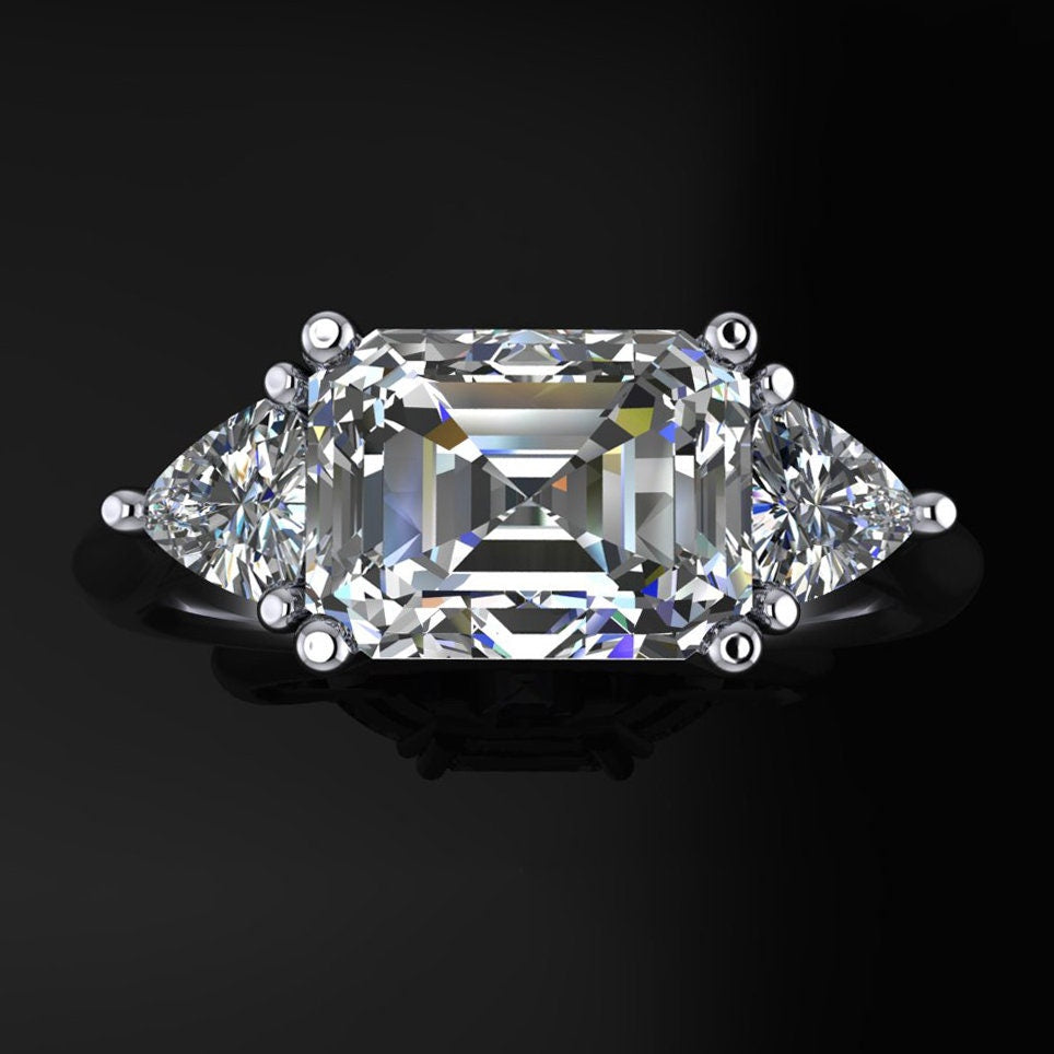 Emerald cut 3 stone moissanite engagement ring - top view