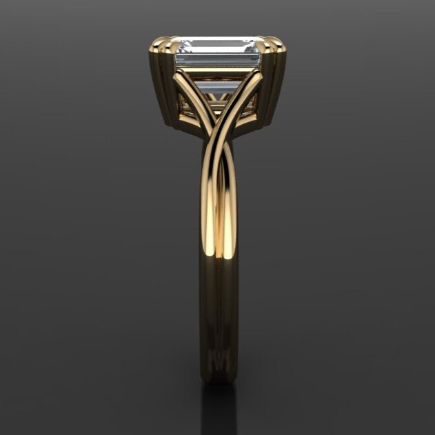 1.75 carat emerald cut lab grown diamond. G color, VS1 clarity, solitaire engagement ring with a split band and double claw prongs -second profile view