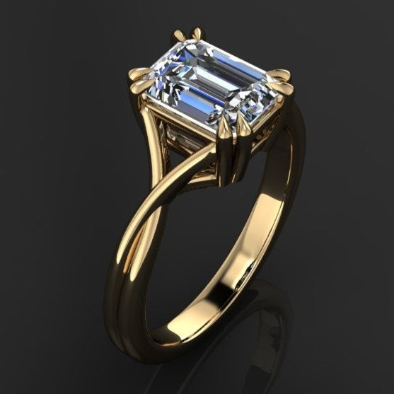 1.75 carat emerald cut lab grown diamond. G color, VS1 clarity, solitaire engagement ring with a split band and double claw prongs -angle view