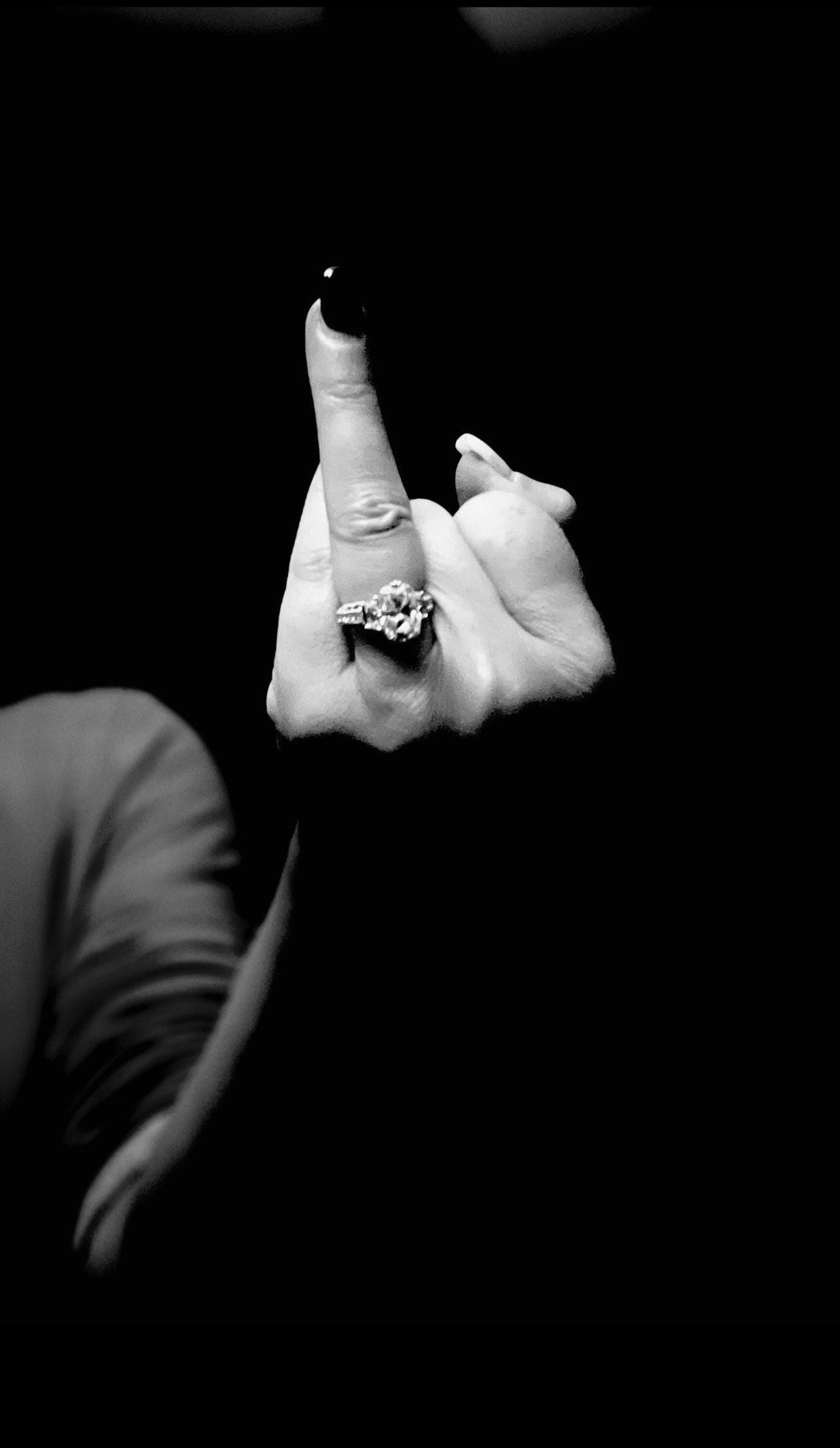 proposal photo of a woman with her ring finger up in black and white