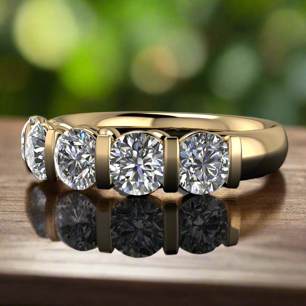 olivia ring - 5 stone round diamond ring, anniversary band - laying down on a wood table with green leaves in the background
