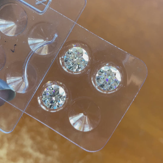 video of loose round moissanite stones