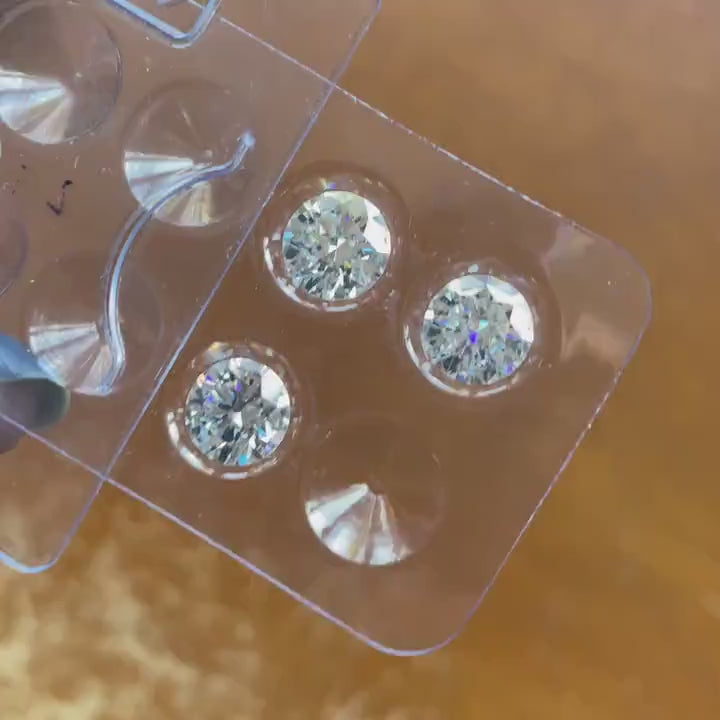 video of loose round moissanite stones 