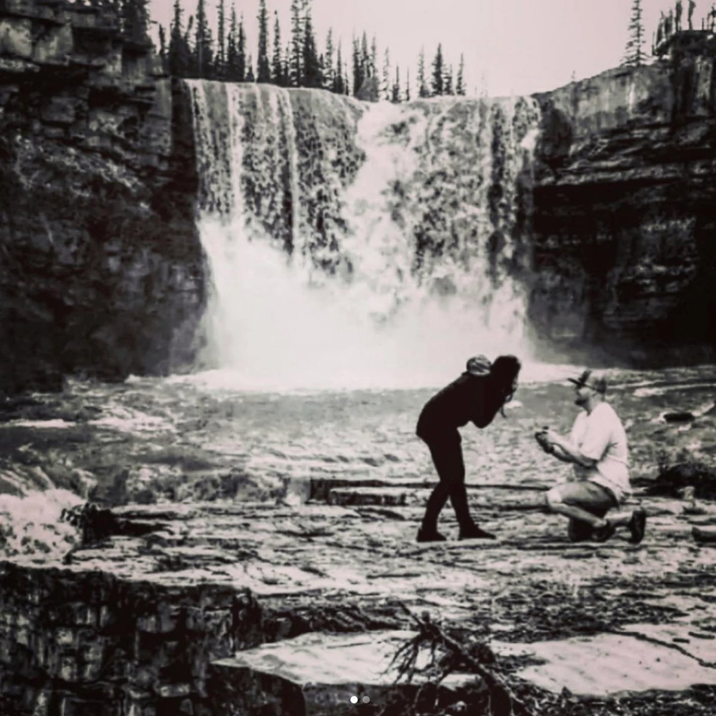 customer submitted photo of their engagement moment, in front of a waterfall - J Hollywood Designs