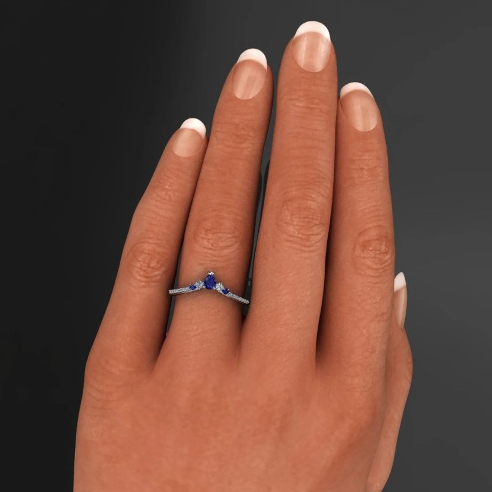 contoured moissanite and sapphire wedding band on hand model - J Hollywood Designs